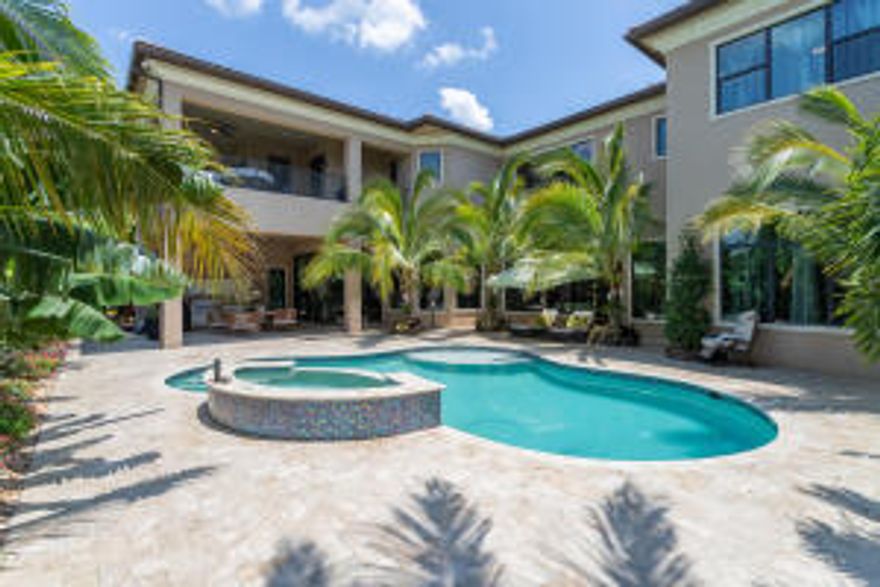 THIS HOME IS A GREAT VALUE! MUST SEE TO FULLY APPRECIATE! Welcome Home to Seven Bridges. The impressive newly constructed Vanderbilt model, 6 bedrooms, 8.5 bath, 10,243 total sq ft residence enjoys the privacy of a corner waterfront lot. Guests arrive at a circular marble paved motor court, and are welcomed by the double doors into a 2 story grand foyer. An open floor plan, high ceilings and neutral marble flooring provide beautiful natural light. From the Grand Main Suite, expansive club room, gourmet island kitchen, resort       style pool/spa entertainment area, complete with a   summer kitchen, this beautiful estate encompasses  the South Florida luxury lifestyle. Note: Primary ensuite bathroom, formal dining and 1st level foyer entrance  chandelier does not convey