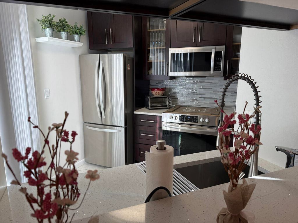 Photo of 10451 W Broward Boulevard #306, Plantation, FL 33324 (MLS # B26001552)