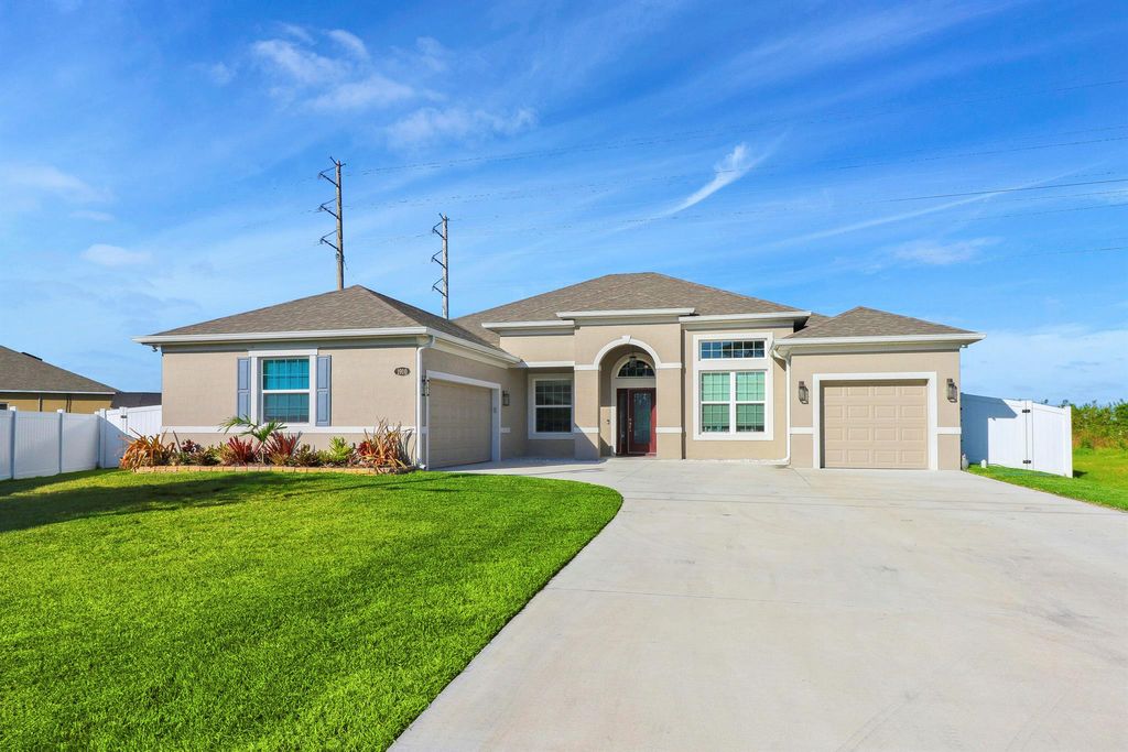 Photo of 1910 SW Mackenzie Street, Port Saint Lucie, FL 34953 (MLS # R10967482)