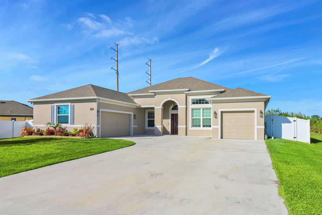 Photo of 1910 SW Mackenzie Street, Port Saint Lucie, FL 34953 (MLS # R10967482)