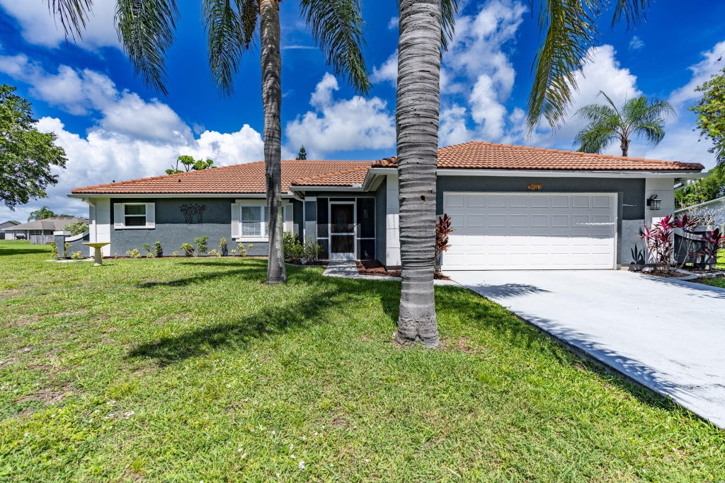 Photo of 2144 SE Elmhurst Road, Port Saint Lucie, FL 34952 (MLS # B26032895)