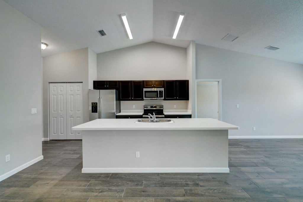 Photo of 1913 SW Swift Avenue, Port Saint Lucie, FL 34953 (MLS # B26068866)