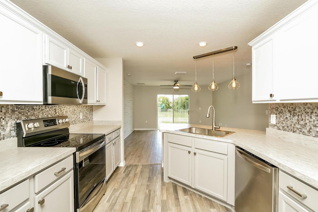 Photo of 973 SE Bayfront Avenue, Port Saint Lucie, FL 34983 (MLS # R11036997)