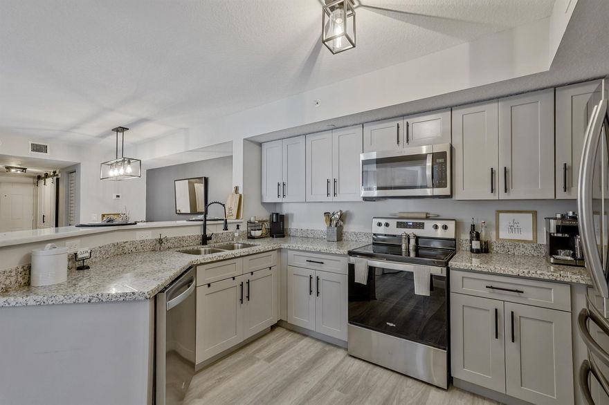 Motivated seller! This rare gated 3-bedroom corner condo is flooded with natural light and fully renovated in 2025. The home features new flooring, soft-close shaker cabinetry, matte black hardware, custom barn doors, Alexa smart fridge, refreshed baths, updated lighting, new ceiling fans, and a stunning stone breakfast bar. A/C (2023), W/D (2023), roof (2022). Some furniture negotiable.

Set within Emerald Isle's resort-style community, residents enjoy a relaxed, amenity-rich lifestyle: sparkling pool, hot tub, gym, racquetball, tennis/pickleball, playground, and gated security. HOA includes cable, internet, water, trash, and exterior maintenance, making this a truly turnkey, low-maintenance home perfect for full-time living or a lock-and-leave escape. Fully updated and move-in ready!