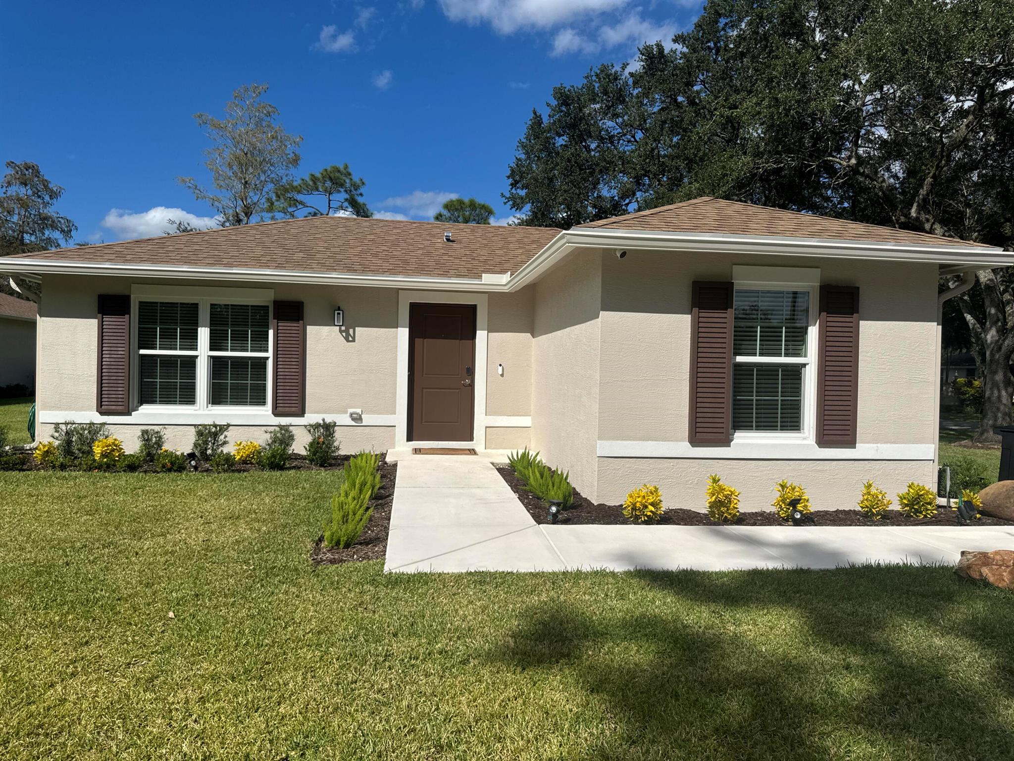 Experience modern comfort just minutes from Wellington's world-famous Polo Grounds and Equestrian venues! This newly built, fully furnished 2BR/1.5BA villa offers the perfect mix of style, privacy, and convenience. Set on a lush lot with its own private driveway and patio, it feels like a standalone home--ideal for seasonal guests, equestrian professionals, or annual tenants. Enjoy an open floor plan with granite counters, stainless steel appliances, and wood-look tile floors throughout. A new privacy fence will soon be installed, adding separation from the main home. Available seasonally at $4,200/mo (120-day min) or annually at $3,200/mo. Close to WEF, Global Dressage, shopping, and dining!