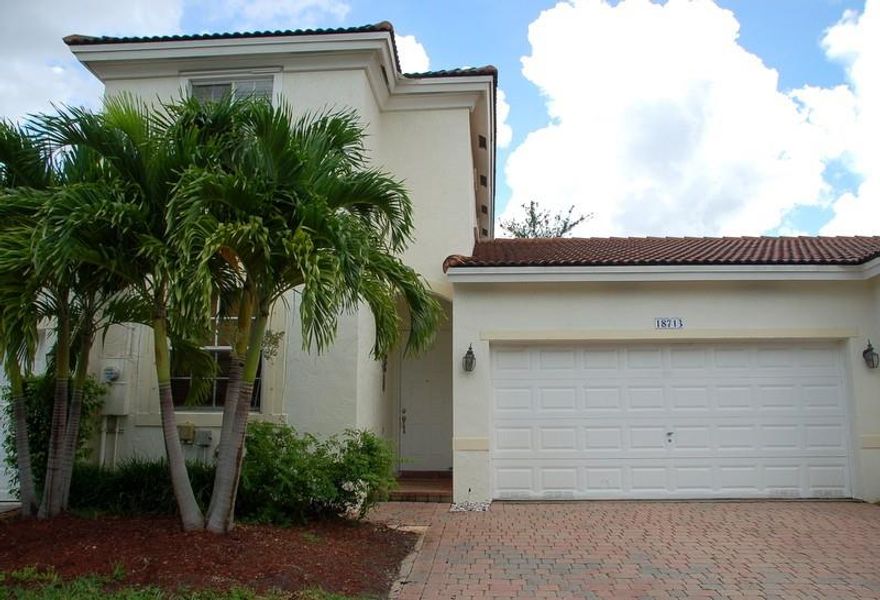 Highly sought after gated community of Grand Key at Sunset Lakes. 3 bedroom and 3 full baths with a 2 car garage. One bedroom and full bath downstairs and primary suite and a 2nd ensuite upstairs. Some photos have been virtually enhanced. Home is currently being freshly painted and new flooring installed. Enjoy the Grand Key community pool and tot lot and you also have access to the resort style amenities of Sunset Lakes with a lakefront picnic area, swimming pool, children's pool, fully equipped gym, tennis, basketball courts, volleyball courts, the list goes on! Minutes from desirable public schools and charter schools.