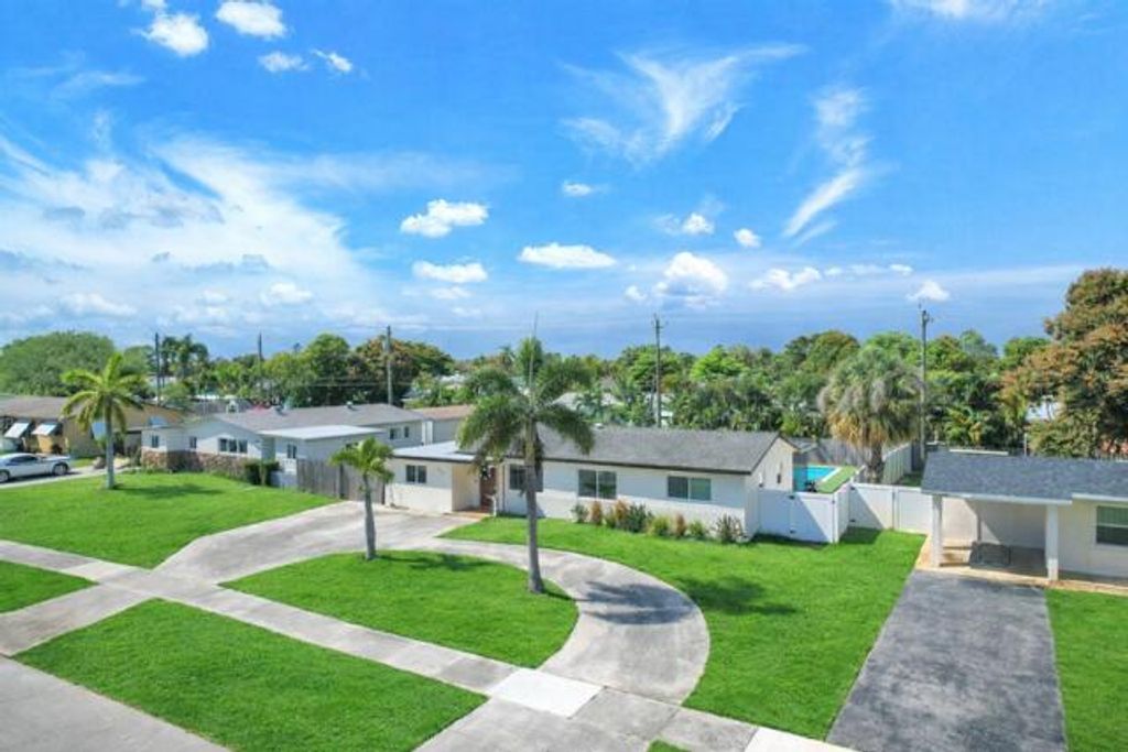 Photo of 731 W Ilex Drive, West Palm Beach, FL 33403 (MLS # B26002571)