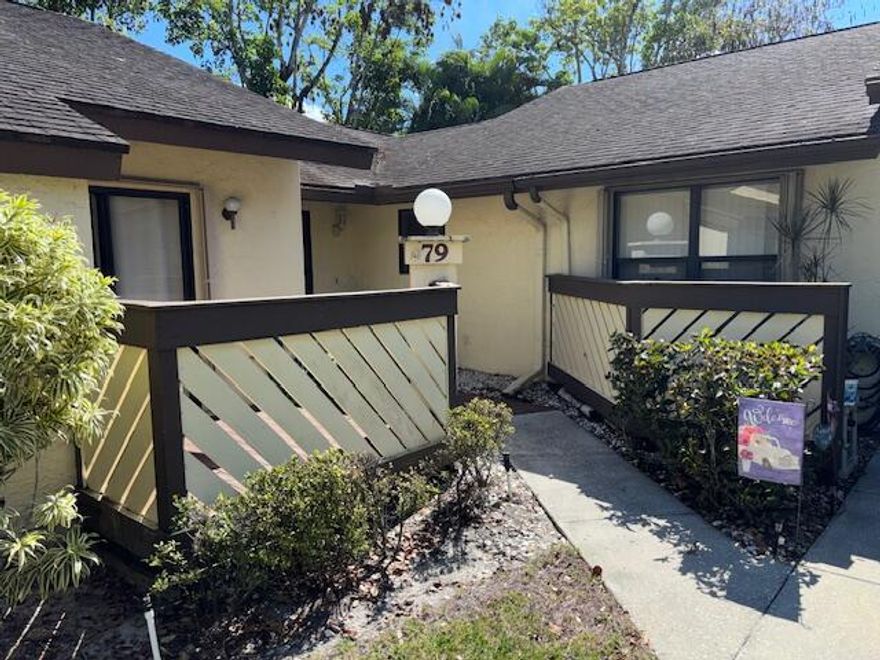 Very nice corner unit!  No carpet, all tile, and newer laminate in master bedroom.  Kitchen was updated with granite counter tops.  The curtains are custom made, and there are accordion shutters.  The enclosed patio is tiled, and leads to the back where there is a navigable canal.  Full size washer and dryer, and storage area off of front patio.  Priced to move!