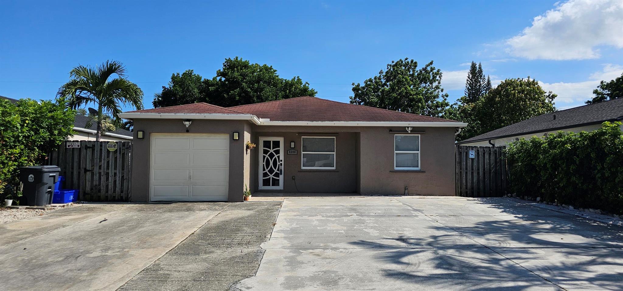 Ready to call this single family 3 bedroom, 2 bath home with office/possible a 4th bedroom/storage room with a private backyard home? Completely renovated, including impact windows, wood look tile floor, updated kitchen and baths, expansive screened back patio with outdoor kitchen, shed and fully fenced yard.. Lawn care and water included in the rent. Dogs allowed but no aggressive breads. Garage has been converted to AC living space.
