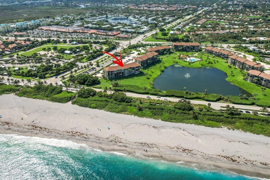 ***LOWEST PRICED IN THE COMMUNITY with an ocean view***80K PRICE ADJUSTMENT!!!
Building 701 is one of the closest buildings to the ocean on the south side of the community. Across the beach, park and short walk to Juno Pier. 2bedroom/2-baths 2nd floor condo with ocean view from the living room, dining room, kitchen and master bedroom. An opportunity to customize your beach condo.  Walk to beach, shopping and dining. Gated community with pool and tennis. Excellent location.