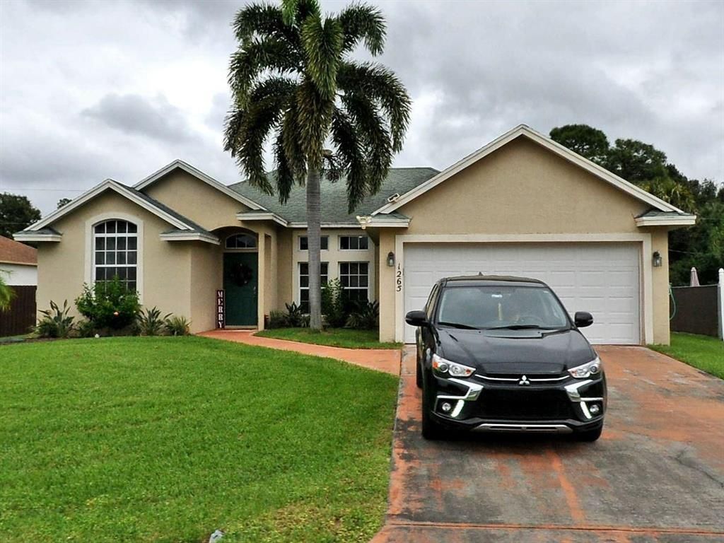 Photo of 1265 SW Fletcher Lane Ln, Port Saint Lucie, FL 34953 (MLS # R10832656)