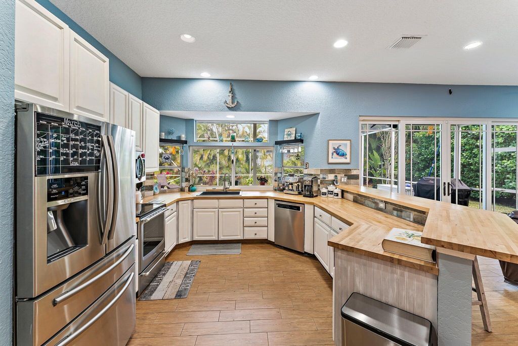 Photo of 19115 SE Coral Reef Lane, Jupiter, FL 33458 (MLS # B26012205)