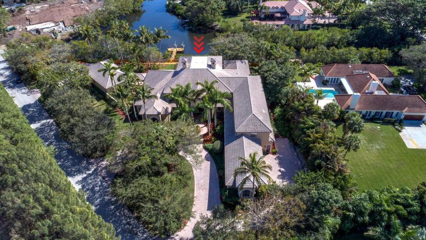 Classic Elegance defines this Mizner Inspired Architectural Masterpiece. Exquisite Finales, Arches, Columns, Palladian Windows, Magnificent Hallways and Breezeways are showcased in this Spectacular Residence complete with a Home Theater, Gym, Guest House, Library, Video Game/Playroom, Massage Room, Game Room, Gourmet Island Kitchen, Butler's Pantry, Fireplace and Elevator. Enjoy Fabulous Outside Entertaining Areas inclusive of Summer Kitchen/Bar, Saltwater Filtration Pool & Spa, Cabana Bath, Tiered Patios, Boardwalk and Dock with Lift for Small Boat. Impact Windows & Doors, Lutron Lighting & much more.1400 feet to the Atlantic Ocean and Deeded Beach Access to one of the Best Private Beaches in South Eastern Florida complete with beach stairs, shower and parking for SL residents!