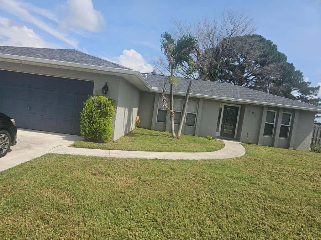 Photo of 301 SW VIOLET Avenue, Port Saint Lucie, FL 34983 (MLS # B26058848)