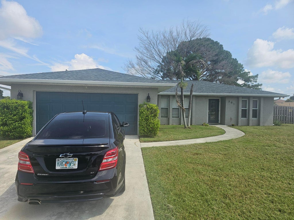 Photo of 301 SW VIOLET Avenue, Port Saint Lucie, FL 34983 (MLS # B26058848)