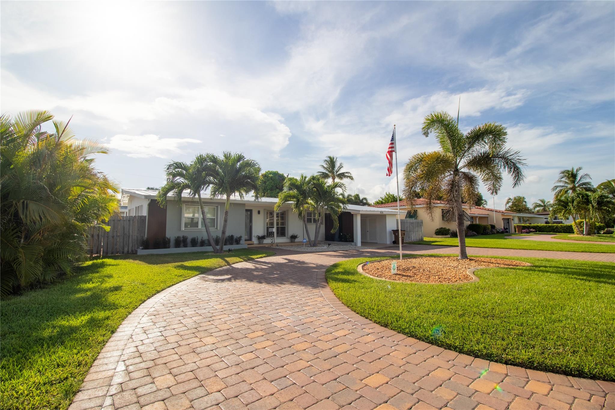 Stunningly remodeled 3-bedroom, 2-bath home plus den/office, located in the highly sought-after Cove neighborhood—just 3 minutes to the beach! This move-in ready gem features a newer metal roof, full hurricane protection, and a private pool surrounded by lush landscaping and a beautiful backyard patio perfect for outdoor living. Impact front doors, sliding door, and accordion shutters throughout. Enjoy the convenience of a circular driveway, no HOA, and ample space for boat and RV parking. The open-concept layout, modern finishes, and tropical curb appeal make this home a true standout. Prime location east of US-1, close to shopping, dining, and everything Deerfield Beach has to offer. Easy to show—don’t miss this opportunity!