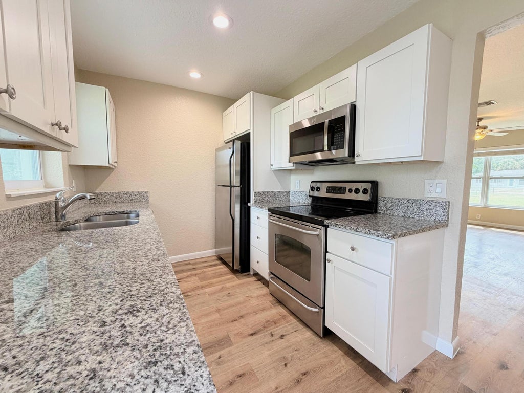 Photo of 8748 Sunset Drive, Palm Beach Gardens, FL 33410 (MLS # B26068949)
