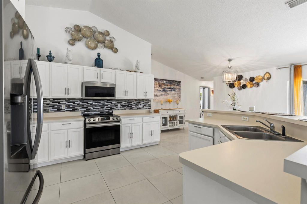 Photo of 556 SW Crawfish Drive, Port Saint Lucie, FL 34953 (MLS # R11016692)