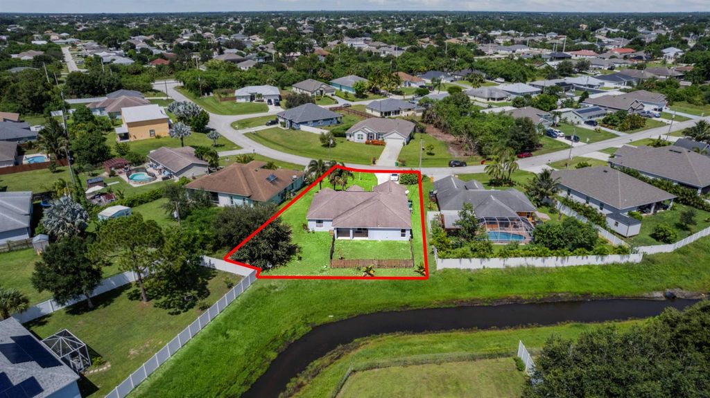 Photo of 556 SW Crawfish Drive, Port Saint Lucie, FL 34953 (MLS # R11016692)