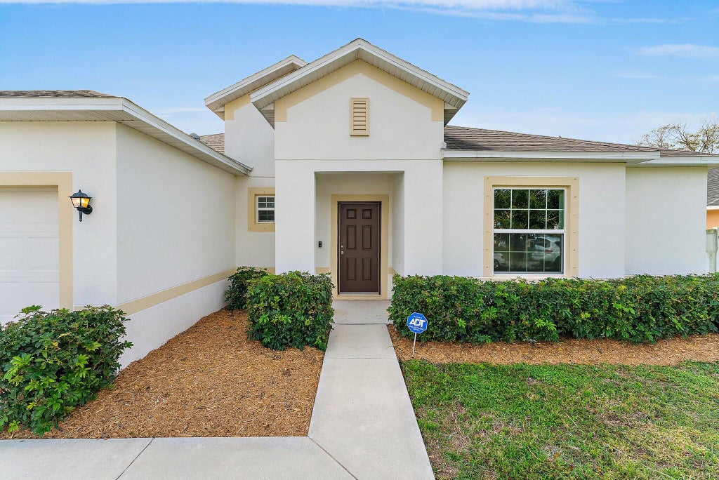 Photo of 474 SW Saginaw Avenue, Port Saint Lucie, FL 34953 (MLS # R10965595)