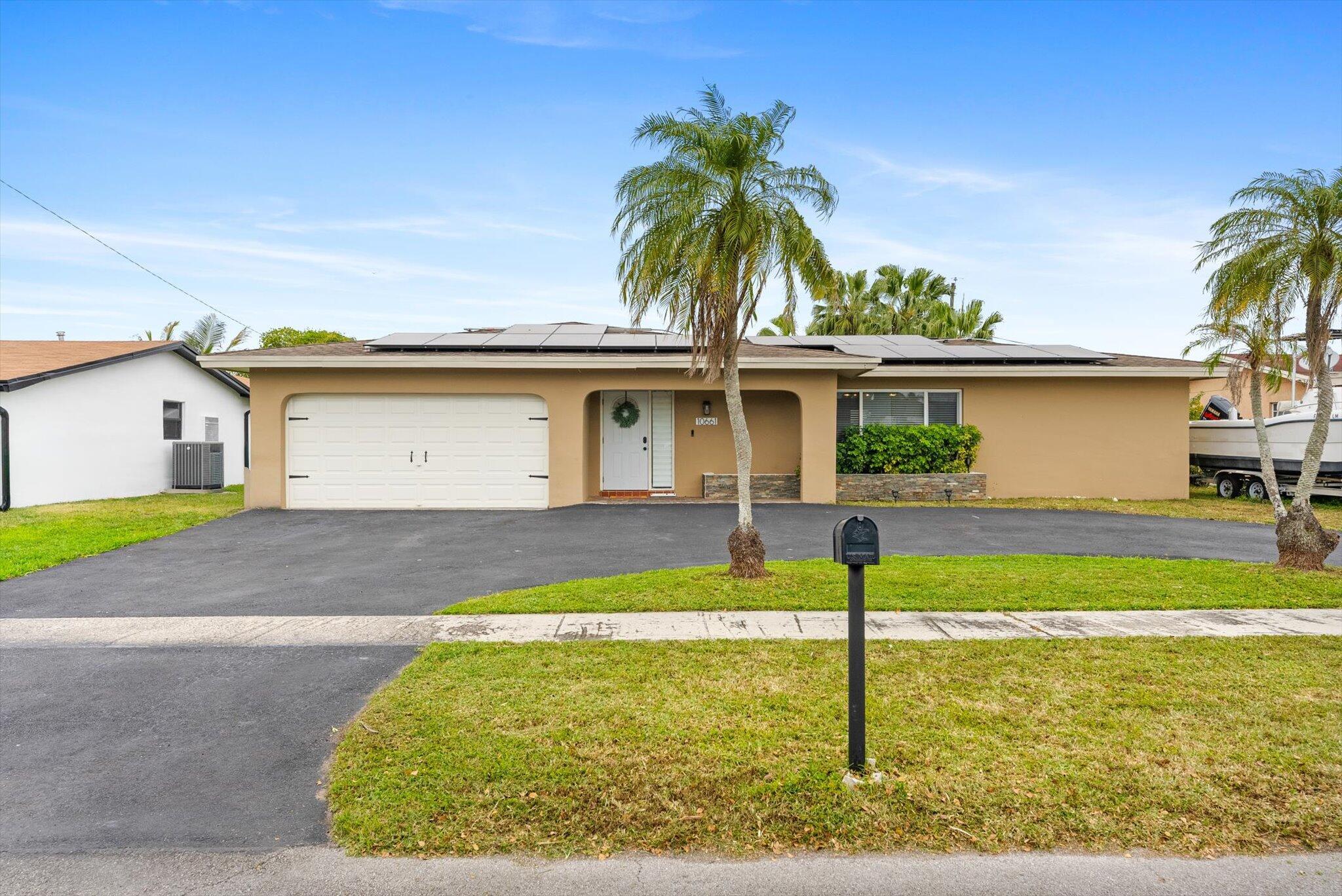 Welcome to your dream home! This beautifully updated 4-bedroom, 2-bathroom gem is nestled on a peaceful, quiet street in Sunrise. Whether you're looking to settle down or invest, this home has it all.Enjoy a bright, open layout with remodeled bathrooms and a stylish kitchen featuring a gas stove--perfect for home chefs! The home boasts impact windows and an impact-rated garage door, fresh exterior paint (2022), a newer AC (2020), and a spacious 2-car garage. Step outside to a lovely pavered patio and sparkling pool, ideal for weekend barbecues and family gatherings.Best of all, there are no parking restrictions--bring your boat, jet ski, or RV with ease!This is the perfect home for a large family that loves to entertain and make memories. Don't miss out!