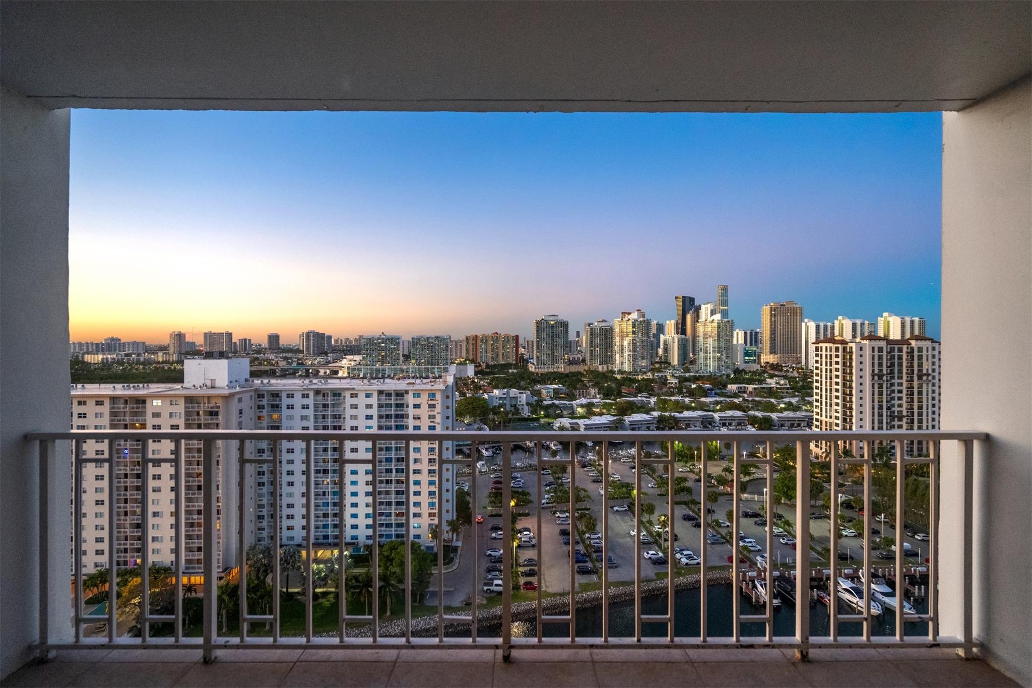 Experience luxury in this stunning 2 bed, 2 bath home with brand new luxury vinyl flooring and breathtaking sunrise and sunset views from each room and the balcony. The updated kitchen features granite countertops and newer stainless steel appliances, including a range and microwave. Located steps away from the beach and close to abundant restaurants and shopping. Situated in a full-service building with valet parking, a 24-hour front desk, a relaxing pool, and private boat dockage. A perfect lifestyle choice! easy to show!