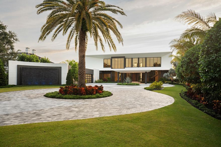 Positioned on the most coveted point along the pristine Loxahatchee River, 5211 Pennock Point is not just a residence. It is a legacy address in one of Jupiter's most exclusive enclaves. This iconic riverfront estate commands an unparalleled panorama that few in South Florida can claim, offering unobstructed sweeping views straight down the river to the legendary Jupiter Lighthouse, where every sunrise ignites the water in gold and every twilight paints it in fire.

Imagine owning the premier point lot on prestigious Pennock Point. A total of 1.29 acres of elevated private paradise with 153 feet of direct river frontage. This is more than waterfront living. It is a front row seat to nature's daily masterpiece, framed by timeless natural beauty and the rare serenity... that defines true exclusivity. Yet you are never isolated. Effortless ocean access awaits via the nearby Jupiter Inlet, placing world class boating, fishing, and sandbars at your doorstep. Proximity to elite golf courses, pristine white sand beaches, Michelin level dining, and private aviation further amplifies the unmatched lifestyle this location delivers.

Step through the private gated entry into a brand new masterpiece of uncompromising craftsmanship and sophistication. The home spans luxurious living with five bedrooms plus a dedicated fitness suite, eight full baths, and two half baths. Every detail has been elevated to billionaire standards, including Port Laurent marble, exquisite stone and quartzite surfaces, a gallery worthy chef's kitchen, a climate controlled wine room curated for the most discerning collector, and meticulously selected designer lighting that sets the perfect mood throughout.

The primary suite is pure indulgence, offering sweeping river vistas from the bed, a private morning bar for sunrise rituals, dual spa caliber baths, and two expansive custom dressing rooms that rival the finest retail experiences. Upstairs, three additional ensuite bedrooms provide ideal separation for family, guests, or staff. The amenity collection rivals that of a private resort and includes a twelve seat theater for cinematic evenings, an indoor sauna for ultimate relaxation, dual laundry rooms, a seamless elevator, full Lutron smart home integration, a whole home generator, and a seven zone air conditioning system with a dedicated mini split for the four car garage.

Outside, the east facing orientation captures breathtaking morning light while centering the iconic Jupiter Lighthouse on the horizon. The resort level outdoor environment features a dramatic twenty by fifty heated saltwater pool, an oversized spa, expansive screened terraces, a fully vented summer kitchen, and an outdoor shower. Each element is designed to embrace the rhythm of the river and transform everyday living into a refined coastal experience.

This is not merely a home. It is a rare opportunity to secure one of South Florida's most irreplaceable riverfront settings, where world class architecture meets unmatched natural prestige. For the visionary who demands the extraordinary, 5211 Pennock Point awaits as a private legacy on the Loxahatchee River.