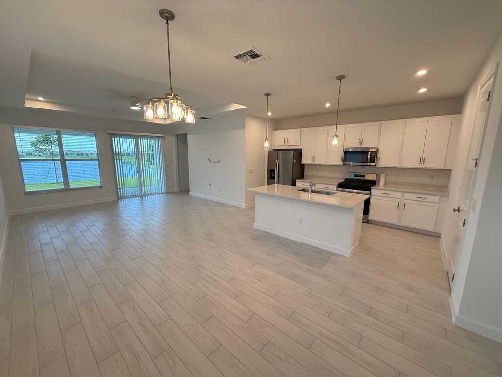 Photo of 9691 SW Indra Way, Port Saint Lucie, FL 34987 (MLS # R11094550)