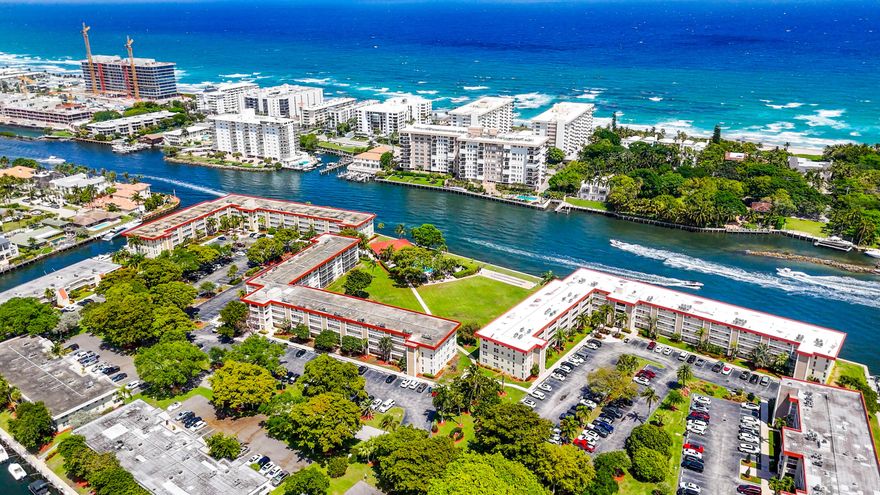 Enjoy unparalleled sweeping Intracoastal views from this rarely available 4th-floor corner unit 3-bedroom, 2-bath condo at Palm Aire at Coral Key in the heart of Lighthouse Point. Perfectly positioned with incredible southeast exposure, this light-filled residence showcases breathtaking views down the Intracoastal, allowing you to enjoy both stunning sunrises and sunset skies from the expansive screened balcony. Freshly painted and move-in ready, this home offers the perfect opportunity to add your own personal touches. Impact windows and doors provide peace of mind, while updated electrical and an in-unit washer and dryer add everyday convenience. The open kitchen features granite countertops, abundant storage, and a breakfast bar ideal for entertaining. Spacious living areas and panoramic water views create an exceptional South Florida waterfront lifestyle. The two secondary bedrooms have been virtually staged and currently feature blue carpeting. Dockage is available for rent through the association, making this an ideal home for boating enthusiasts with easy access to the nearby Hillsboro Inlet. Rarely available with incredible southeast exposure and endless Intracoastal views, this is the perfect place to call home and enjoy waterfront living in one of Lighthouse Point's most desirable locations.  The community pool is right on the Intracoastal and there are BBQ grills around the property, and cable and internet are included in the quarterly fee.  Close to great dining, shopping and all the activities Lighthouse Point has to offer.  The property has full reserves and all no assessments pending.