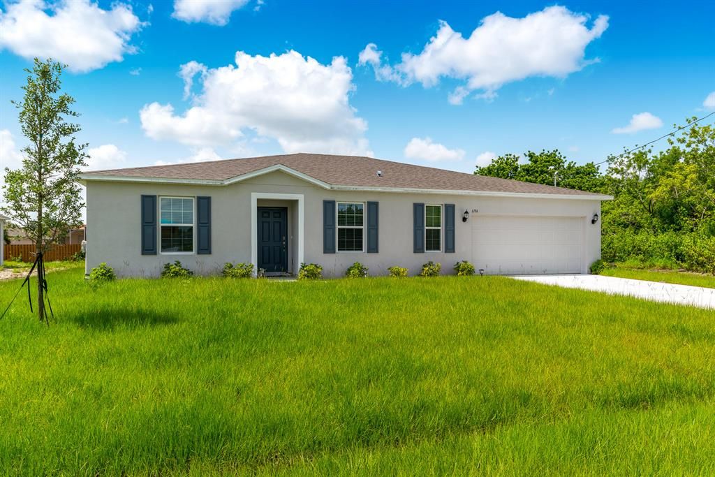 Photo of 6186 NW Gatun Drive Dr, Port Saint Lucie, FL 34986 (MLS # R10819106)