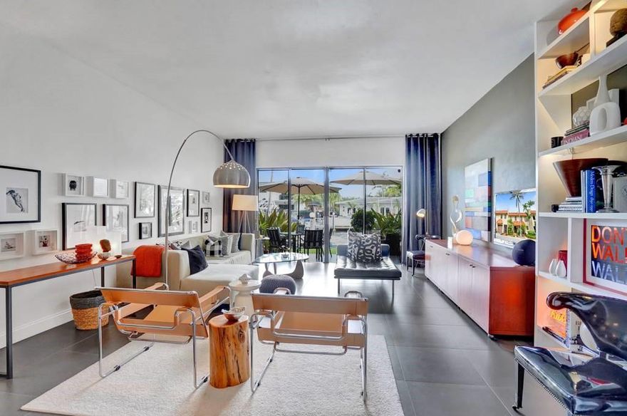 A sought after canal front townhouse at the far eastern end of the community dock and just a very short distance to the open bay with direct access to Haulover inlet. A complete permitted renovation four years ago brought this townhouse up to code with tasteful upgrades to all areas. A total replacement of the AC system in July 2019 and also the internal cast iron piping makes this property a worry free environment. Dock available for boats with just a yearly charge of $150. Views of the water and Miami Beach from the second floor balcony off the main master bedroom suite which is the largest configuration in the community with full bathroom, dressing area, walk-in closet and very spacious bedroom/office area. South facing patio. Simplisafe alarm installed.