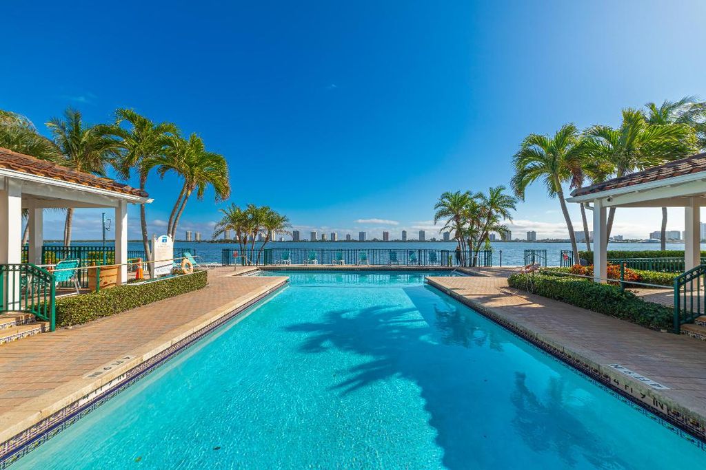 Photo of 1115 Lake Shore Drive #206, Lake Park, FL 33403 (MLS # R11050624)