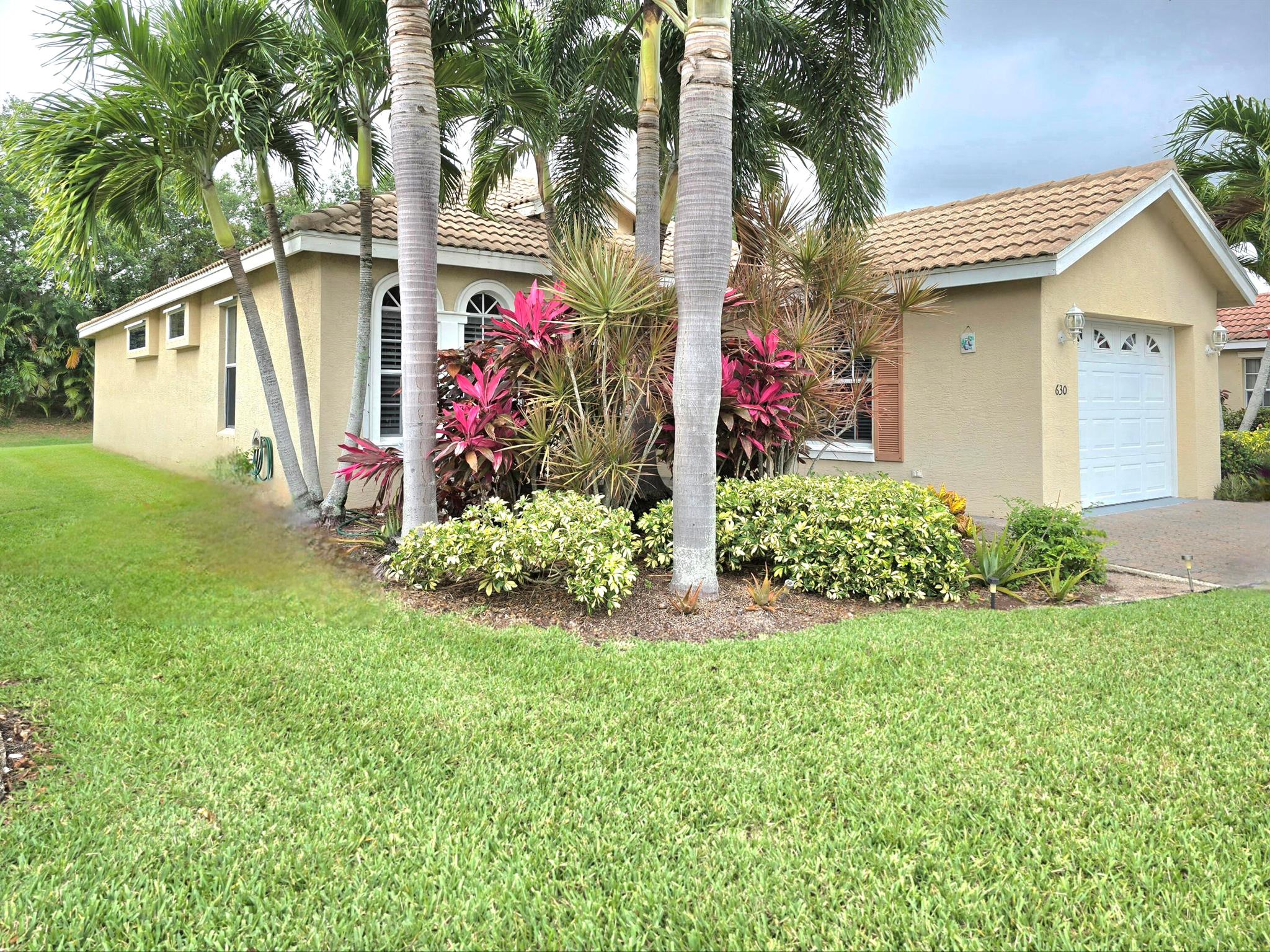 WOW. A Fabulous, Spacious, Spanish Tile Roof Home in St Lucie West, and highly desired Lake Charles Community. New A/C Installed 2016. Cable and Landscaping are Included in Your HOA which is paid Quarterly. Enjoy this magnificent 2 bedroom, 2 bath home, featuring a covered screened-in patio with serene views of a preserve. This large modernized kitchen features white cabinets, and granite counter-tops. The master bedroom features a large walk-in closet, walk-in shower, and double sinks. Whirlpool Front Loader Washer and Dryer. Amenities include pickleball, tennis, basketball and much more. Close to all shopping and dining. You hit a home run when you purchase this home near Met Stadium, i95 and the Tpk. Take me out to the ball game and make this your home-sweet-home.