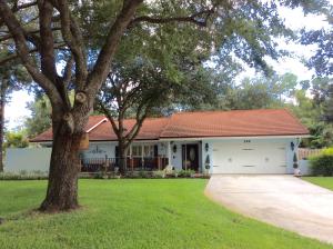 Welcome home! Stunning home in most desirable neighborhood Pinewood Grove of Wellington, the Equestrian Capital of the World. This home is situated on an exquisite 1/2 acre corner lot with beautiful mature oak trees. Peace & tranquility is what you will surrender to, upon approaching this property. Tastefully remodeled & meticulously kept. Coated steel roof with a lifetime transferable warranty. Brand new double pane window throughout. New electrical panel & wiring. New fence, new front porch,10x10 Todd's shed on side yard, plenty of room for a boat or RV, 8x8 hot tub only 2 years old. Gas water heater oven, dryer & cook top. NO HOME OWNER'S ASSOCIATION! Textured ceilings & freshly painted. Plenty room for a custom pool & expansion. A great place to call home! Furniture is negotiable.