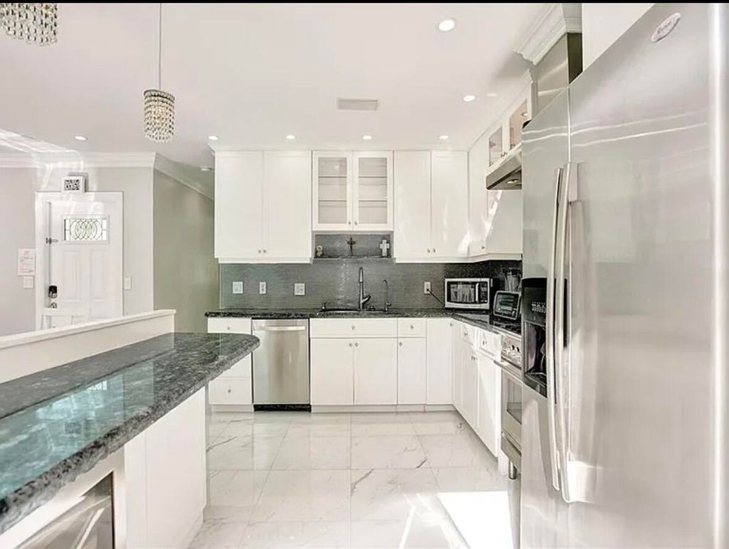 Photo of 1760 Bel Air Avenue, Lauderdale By The Sea, FL 33062 (MLS # B26039555)