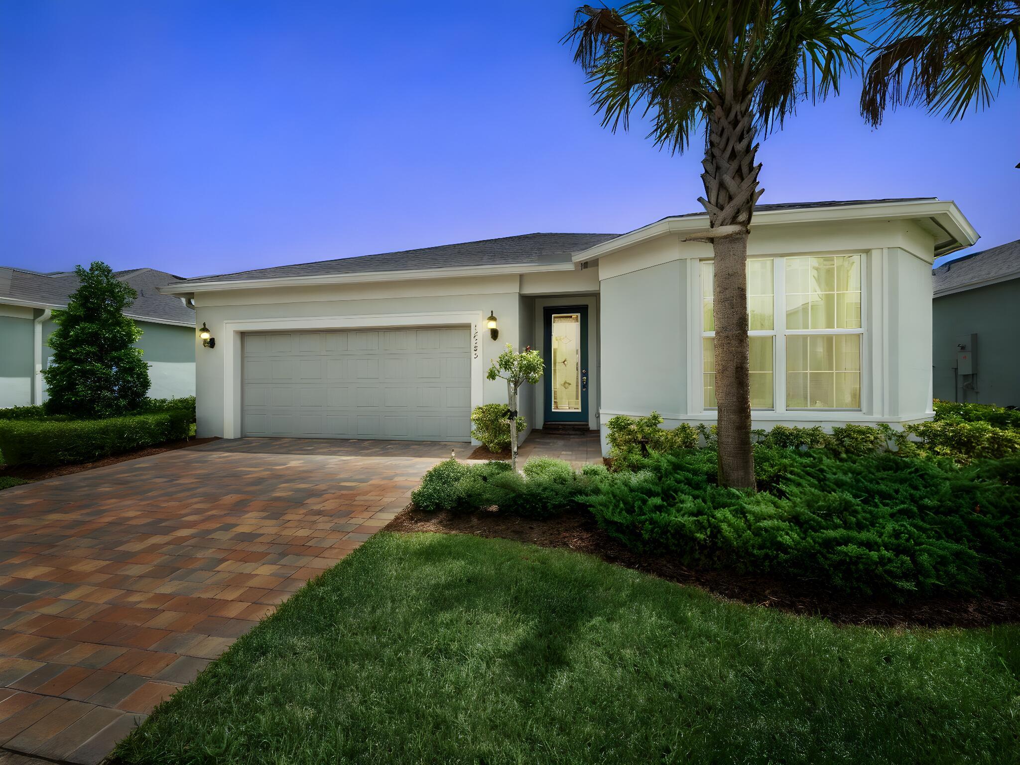 3 Bedroom 2 Bathroom waterfront home with a NEWER 2023 ROOF in the great community of Heron Preserve at Tradition! This home has been meticulously maintained by the owner and is move-in ready for you! This open-concept, split floor plan home can be used as a 3 bedroom or convert one of the bedrooms into your home office/gym. Heron Preserve is one of Tradition's communities for residents who enjoy low-maintenance living with lawn care included! Enjoy your downtime from your private, screened in covered patio or relax by the community pool!. You are conveniently located to parks, Tradition Square and events, highway I-95 access, Cleveland Clinic and so much more! Schedule your showing to see this home and to start living life in Tradition the Heron Preserve way!