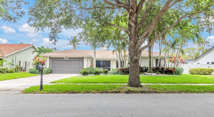 Well priced four BR waterfront pool home in the immaculately maintained community of Jacaranda Lakes. All bedrooms are generously sized, especially the primary suite, which features an extra large closet and a walkout that leads directly to the covered patio. Both the sunken living room and family room share access to the fireplace - two different settings for those frigid South Florida nights. Tropical landscaping and rock beds frame the front of the property, providing curb appeal of pride, and the windows are all impact, of course. The kitchen offers granite counter tops, a floating exhaust hood, and plenty of storage space. Set beside two of the bedrooms is an enclosed outdoor area covered with artificial grass. Be advised that the lakeside dock is in disrepair and is roped off. Video Tour Link:  https://www.youtube.com/watch?v=AkAopqVzYUY