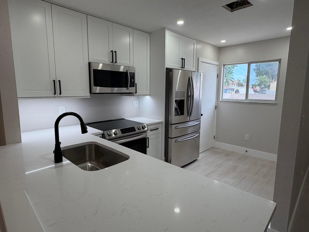 Photo of 6631 Winfield Boulevard #2-6, Margate, FL 33063 (MLS # B26057669)