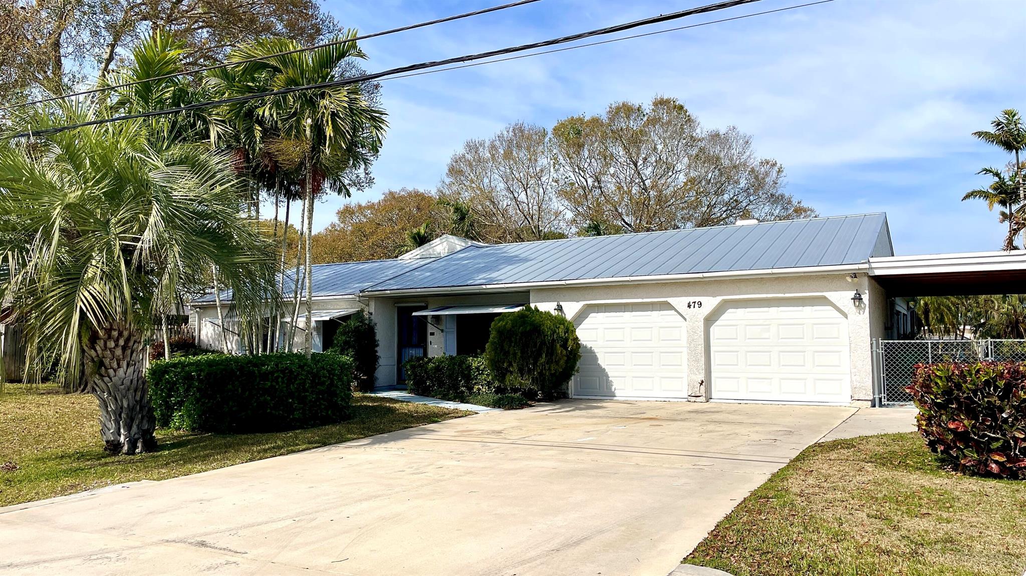 Live the dream in this waterfront oasis! This 3-bed, 2-bath, 2-car garage pool home offers breathtaking views and direct ocean access from your private dock on a deep-water canal. Nestled on an oversized lot with lush fruit trees, it's a true boater's paradise. Inside, enjoy a bright, open layout with two family rooms, a spacious eat-in kitchen, and custom mirrors that reflect natural light throughout. Triple sliders lead to a screened porch and patio--ideal for entertaining. With a metal roof, city water/sewer, and RV or boat parking, this rare gem has it all. Don't wait--schedule your private showing today!