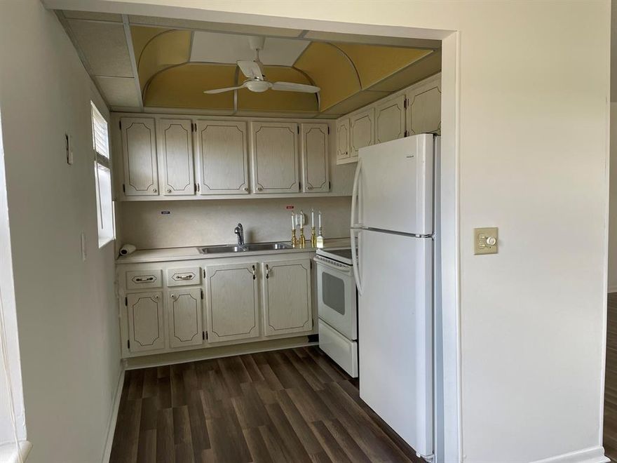 Sunshine abounds in this 2nd floor, corner unit! This lovely, 2 bedroom, 1.5 bath unit for rent in a 55 + adult retirement community in Century Village is freshly painted and ready for you to move into! This wonderful unit features central air conditioning and new flooring. You will enjoy the South Florida lifestyle with amenities such as a fully equipped fitness center, club house with over 1000 seat theater, free transportation, close proximity to PBI airport, shopping, beaches and many restaurants