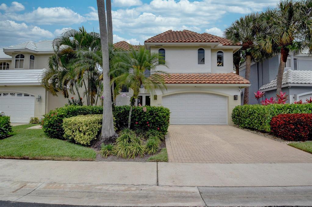 Breathtaking water views welcome you as you enter this newly renovated home complete with impact glass and impact doors throughout (2020), new roof (2017), new kitchen (2018) with custom cabinets, granite L shaped counters with breakfast bar, SS appliances, and adjacent oversized laundry/utility room. Additionally on the main level you will find a dining room, 2 sitting rooms, a bar with wine fridge and glass cabinets, and a new powder room. Upstairs you will find the master suite, 2 additional bedrooms, and separate a sitting area for use as office, reading area, or gym. Nothing to do but to enjoy this beautiful home and the lifestyle and luxuries of Woodfield Country Club.