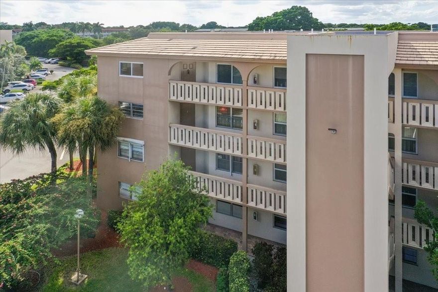 LIVE LIKE YOU’RE ON VACATION! Welcome to Wynmoor, an active 55+ community offering resort-style living. This top-floor corner unit is updated and ready to move in. Being a corner unit, it is filled with natural light & has an open, spacious feel. Enjoy a large updated eat-in kitchen w/ soft-close white shaker cabinetry, quartz countertops, stone tile backsplash & stainless steel appliances. Laminate flooring runs throughout, along w/ impact windows, updated bathrooms, recessed lighting, smooth ceilings, fresh white paint, washer/dryer in unit & a glass-enclosed patio. Wynmoor is an adult playground featuring a magnificent clubhouse, state of the art theater, pools, golf, fitness center, clubs/classes, tennis/pickleball, bus service & much more. Don’t miss your chance to call Wynmoor home!