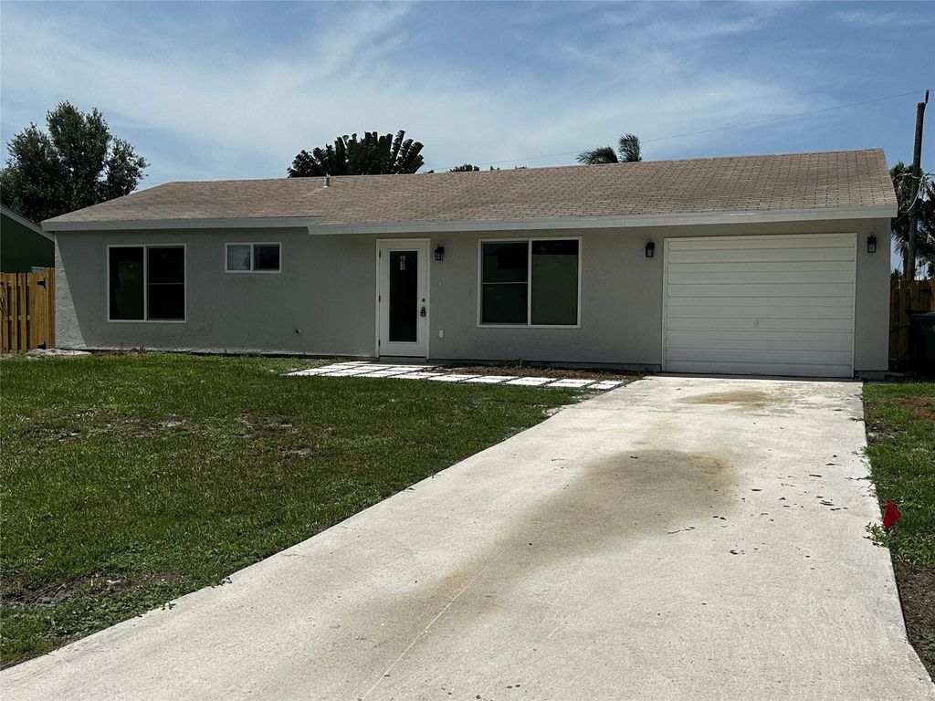 Photo of 581 SE Tanner Avenue, Port Saint Lucie, FL 34984 (MLS # F10452345)