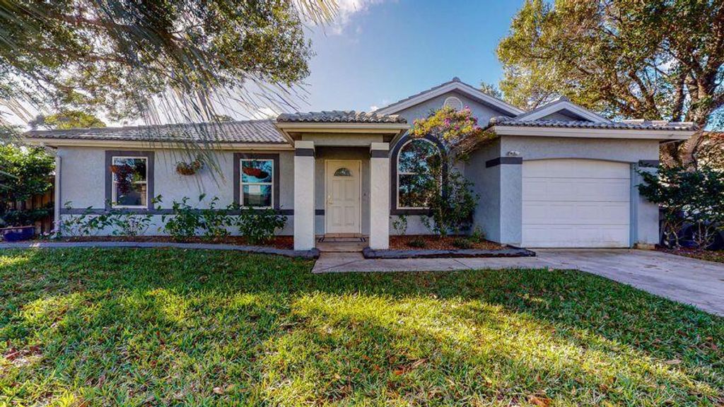 Photo of 970 SW Versailles Avenue Ave, Port St Lucie, FL 34983 (MLS # R10818941)