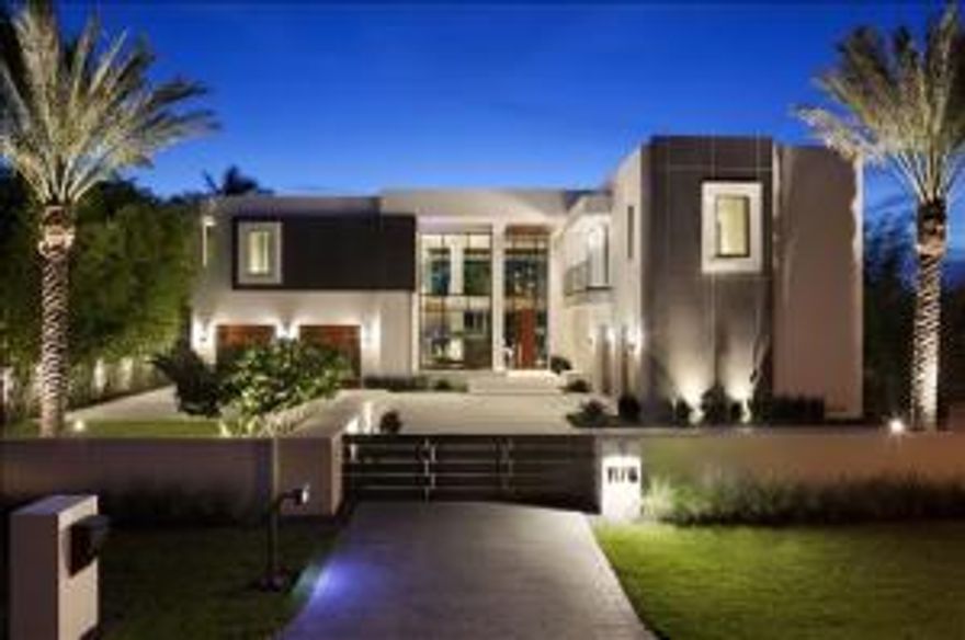 Subtly glamorous modern style captures the essence of Gold Coast living in this brand-new masterwork in The Estates, a prestigious beachside enclave considered the crown jewel of Boca Raton.  Serenely set on the Intracoastal Waterway, this stunningly designed and furnished showpiece is the collaboration of high-end builder J.H. Norman Construction Company, innovative architect George Brewer, award-winning Marc-Michaels Interior Design, and landscape architect Dave Bodker. The information herein is believed to be accurate but is not guaranteed & may be subject to errors/omissions & be changed w/o notice. All measurements are approx. Buyer pays title and doc stamps.