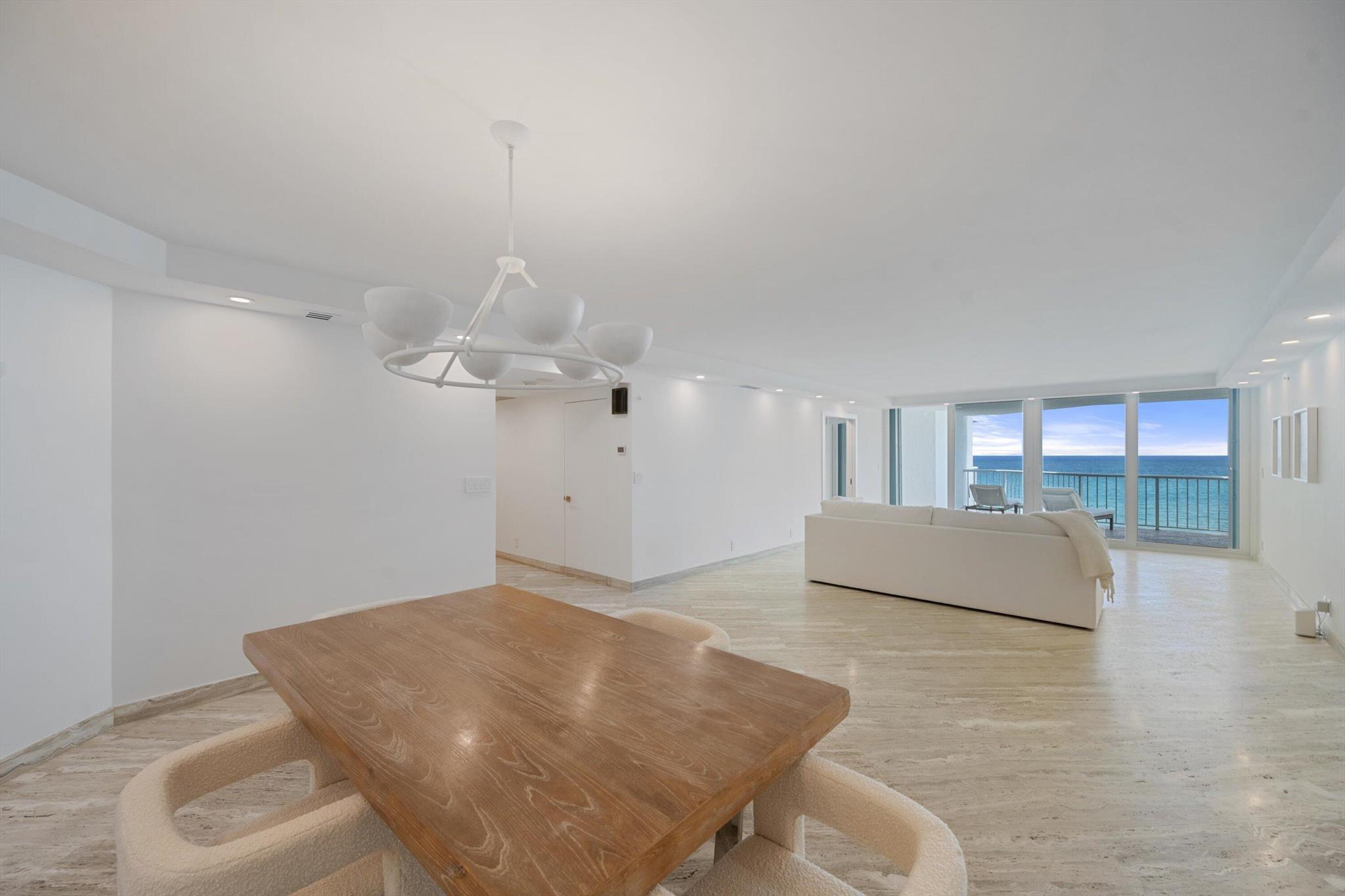 Step into this stunning 6th-floor residence at The Enclave's North Building, where southern exposure floods the space with natural light and showcases sweeping views of the ocean, pool, and Intracoastal. This beautifully renovated home features hurricane-impact doors, silver travertine floors, white cabinetry, stainless steel appliances, and upgraded lighting. The Enclave is a pet-friendly oceanfront community offering 24/7 gated security, doormen, a resort-style pool, a new fitness center, renovated lobbies, and a furnished 2BR guest suite for owners.