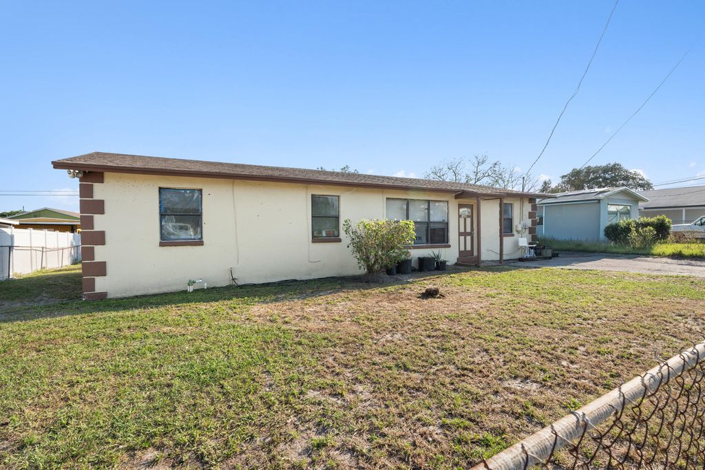 Photo of 1449 W 35th Street, Riviera Beach, FL 33404 (MLS # B26009916)