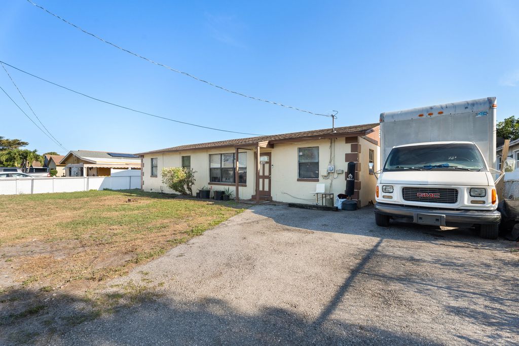 Photo of 1449 W 35th Street, Riviera Beach, FL 33404 (MLS # B26009916)