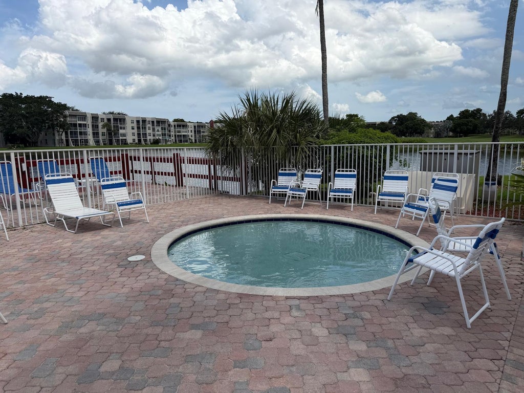Photo of 9470 LIVE OAK Place #404, Davie, FL 33324 (MLS # B26053955)