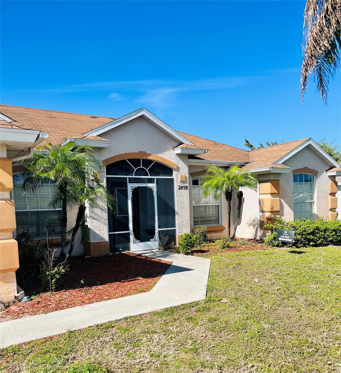 Centrally located and built in 2001, this spacious 4-bedroom, 3-bath CBS home offers the perfect blend of comfort and functionality. Step inside to find vaulted ceilings, tile flooring throughout, and a bright, open layout. The large kitchen is ideal for entertaining with its eat-at bar, skylights, solid wood cabinetry, and a cozy breakfast nook. A full cabana bath leads to the screened-in patio, creating seamless indoor-outdoor living with plenty of room to add a pool. Additional features include a 2-car garage and a thoughtfully designed split-bedroom floor plan for privacy.